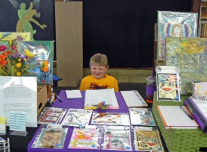 My sweet grandson helping in my booth
